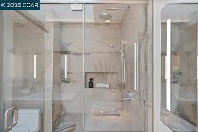 a bedroom with a bed and night stand