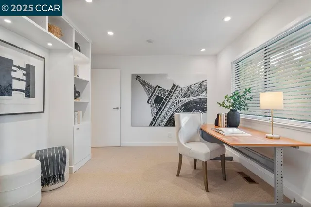 a workspace with furniture and window