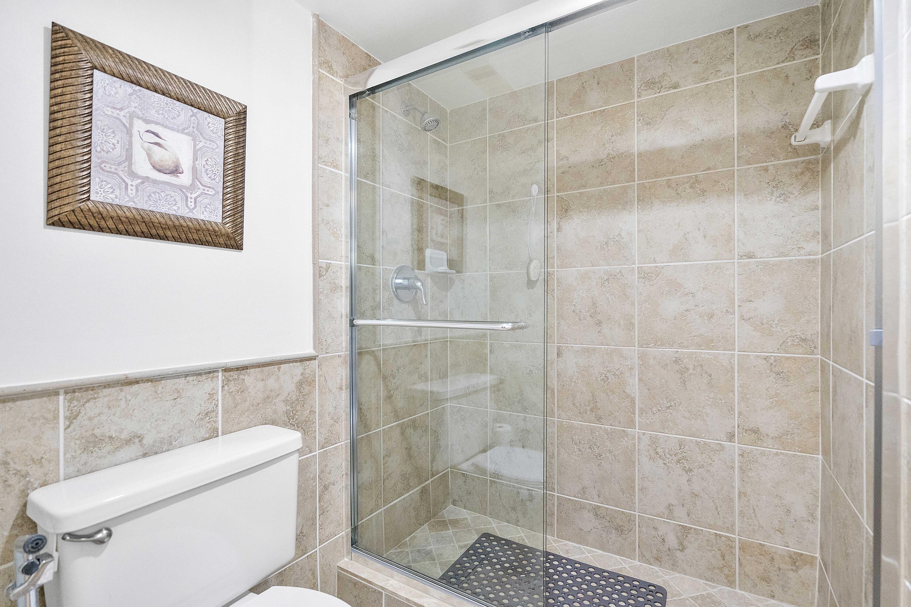 3706 Bridgewood Drive, Unit 3706 Boca Raton, FL 33434 - Photo 30 of 79 a bathroom with a toilet and a shower