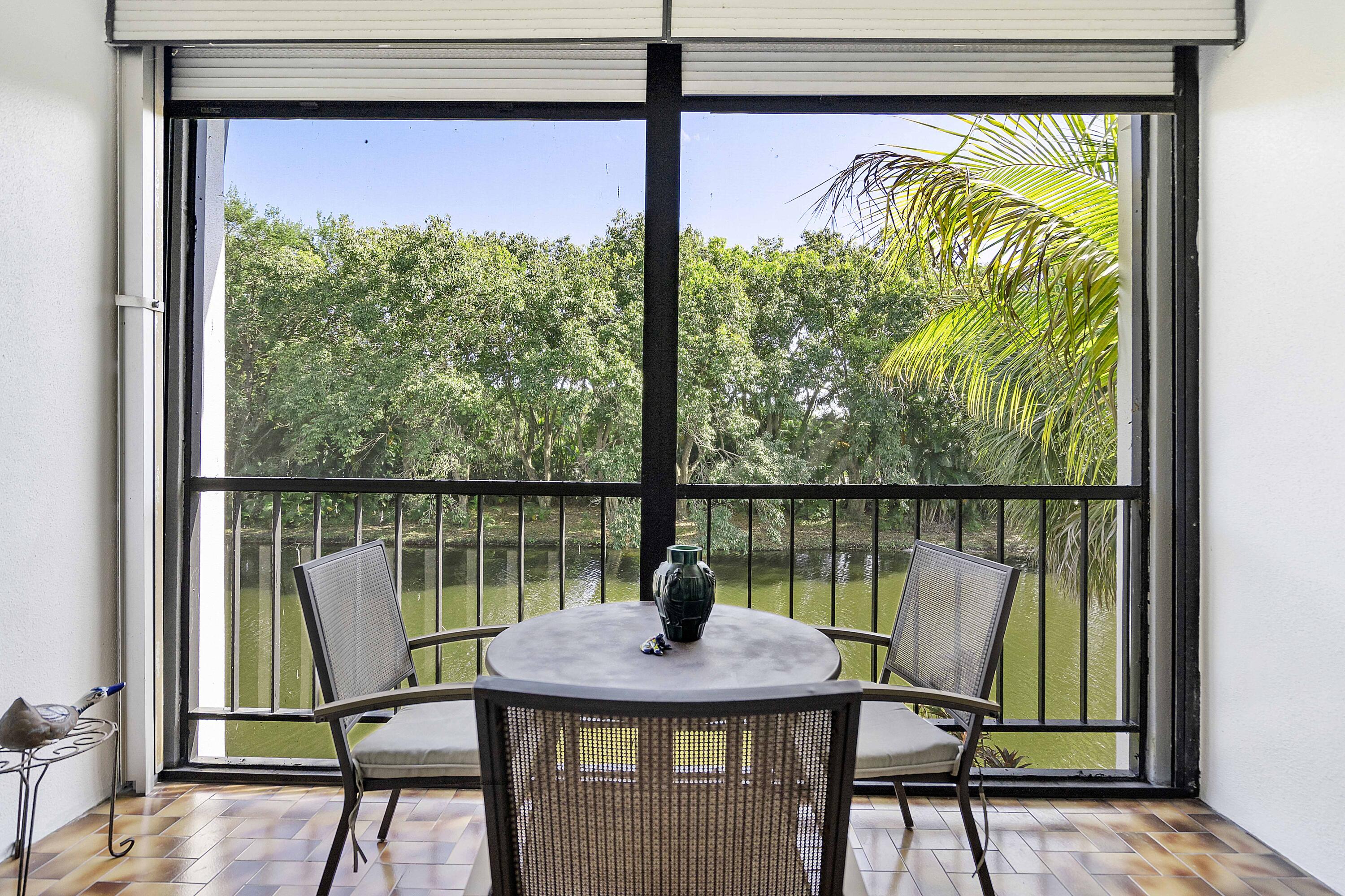 3706 Bridgewood Drive, Unit 3706 Boca Raton, FL 33434 - Photo 33 of 79 a view of a lake from a balcony