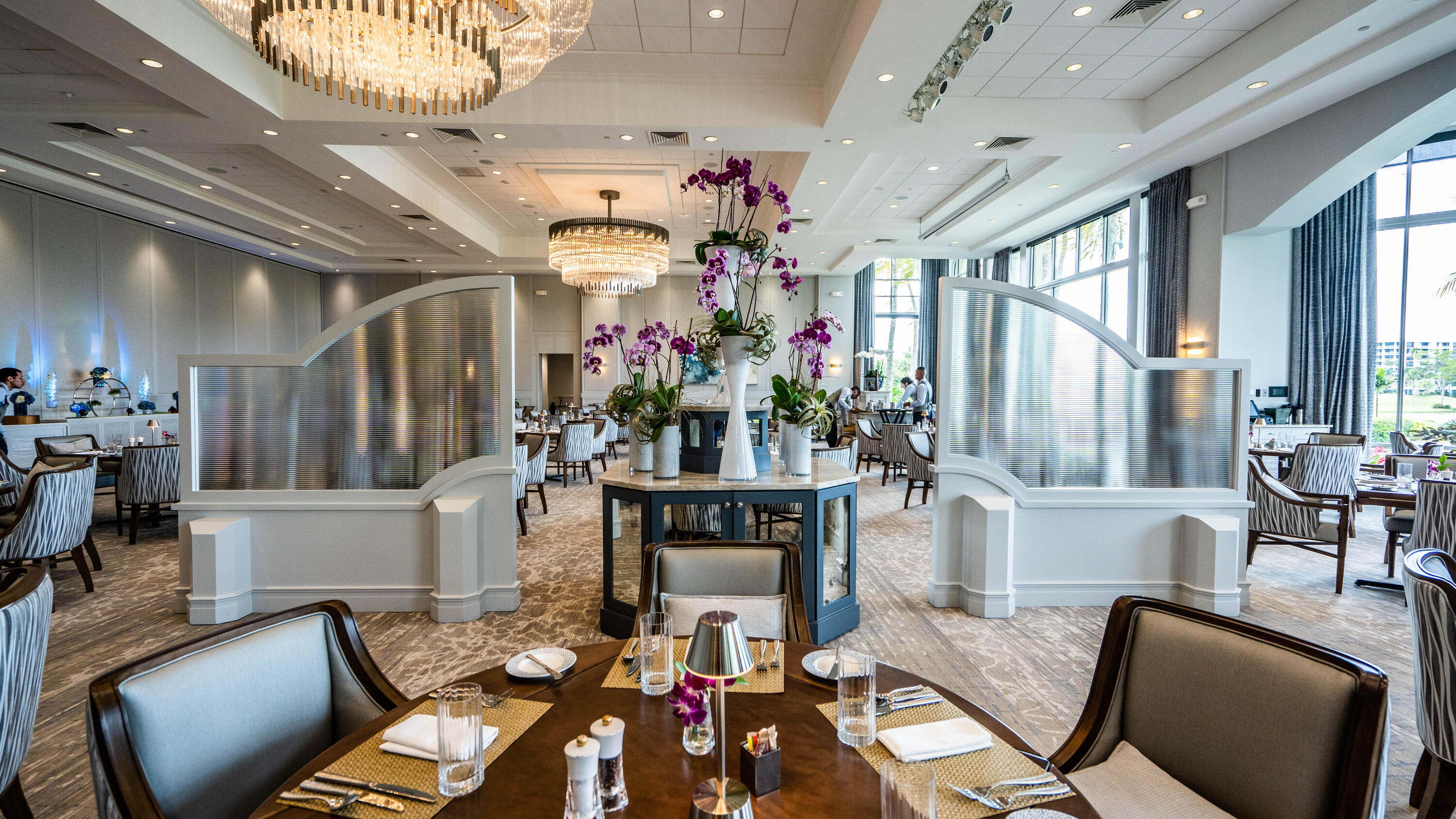 3706 Bridgewood Drive, Unit 3706 Boca Raton, FL 33434 - Photo 61 of 79 a view of a dining room with furniture and a chandelier