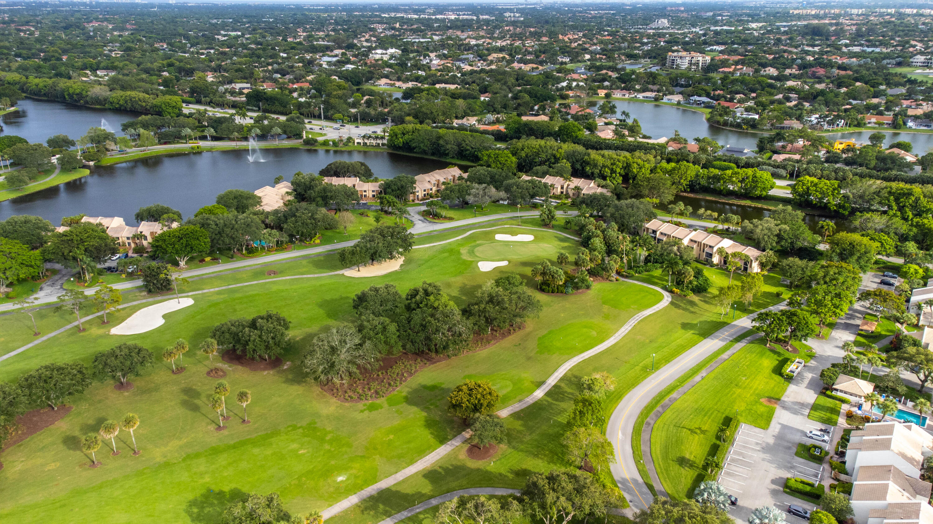 3706 Bridgewood Drive, Unit 3706 Boca Raton, FL 33434 - Photo 72 of 79 an aerial view of residential houses with outdoor space and swimming pool