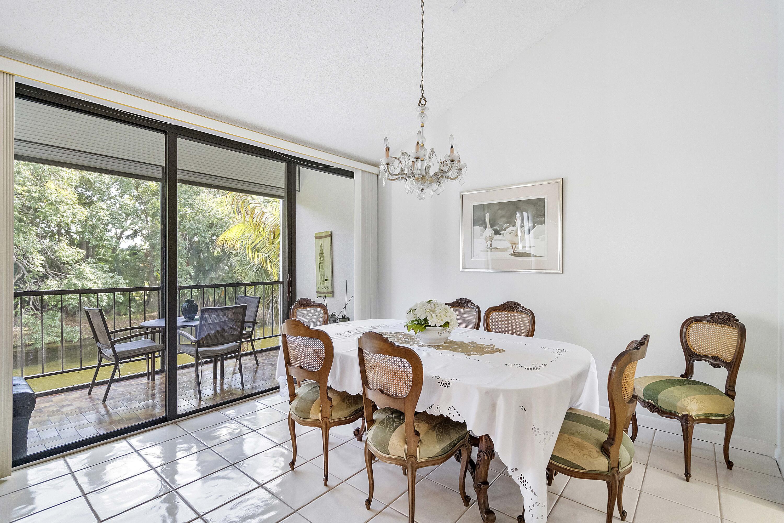 3706 Bridgewood Drive, Unit 3706 Boca Raton, FL 33434 - Photo 10 of 79 a dining room with furniture and window