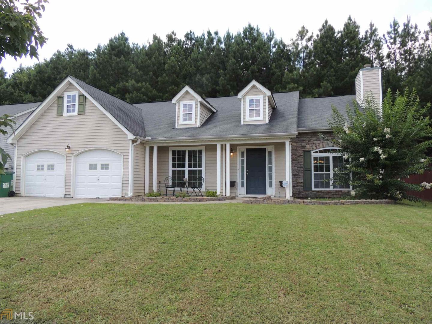 5736 Village Loop Fairburn, GA 30213 - Photo 1 of 1 a front view of a house with a garden and yard