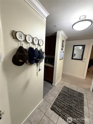a view of a hallway with window and furniture