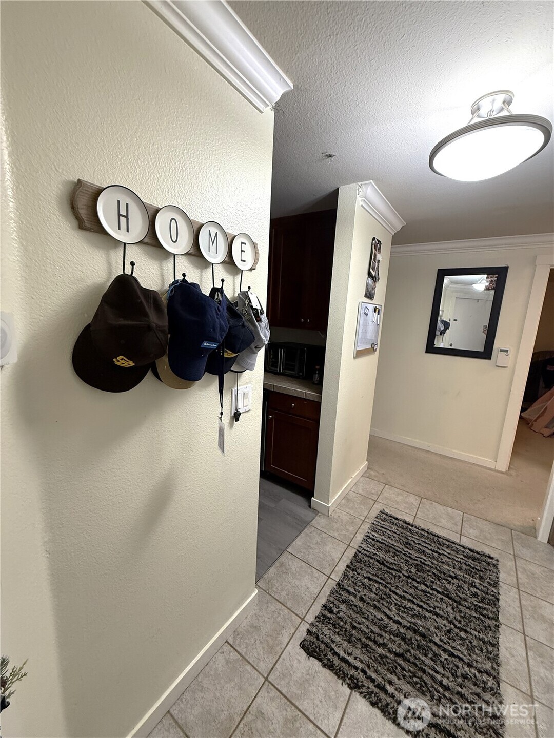 28716 18th Avenue South, Unit Y203 Federal Way, WA 98003 - Photo 2 of 37 a view of a hallway with window and furniture