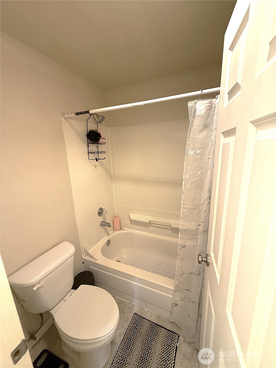 28716 18th Avenue South, Unit Y203 Federal Way, WA 98003 - Photo 21 of 37 a white toilet sitting next to a bath tub