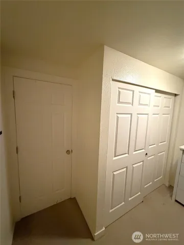 a utility room with cabinets