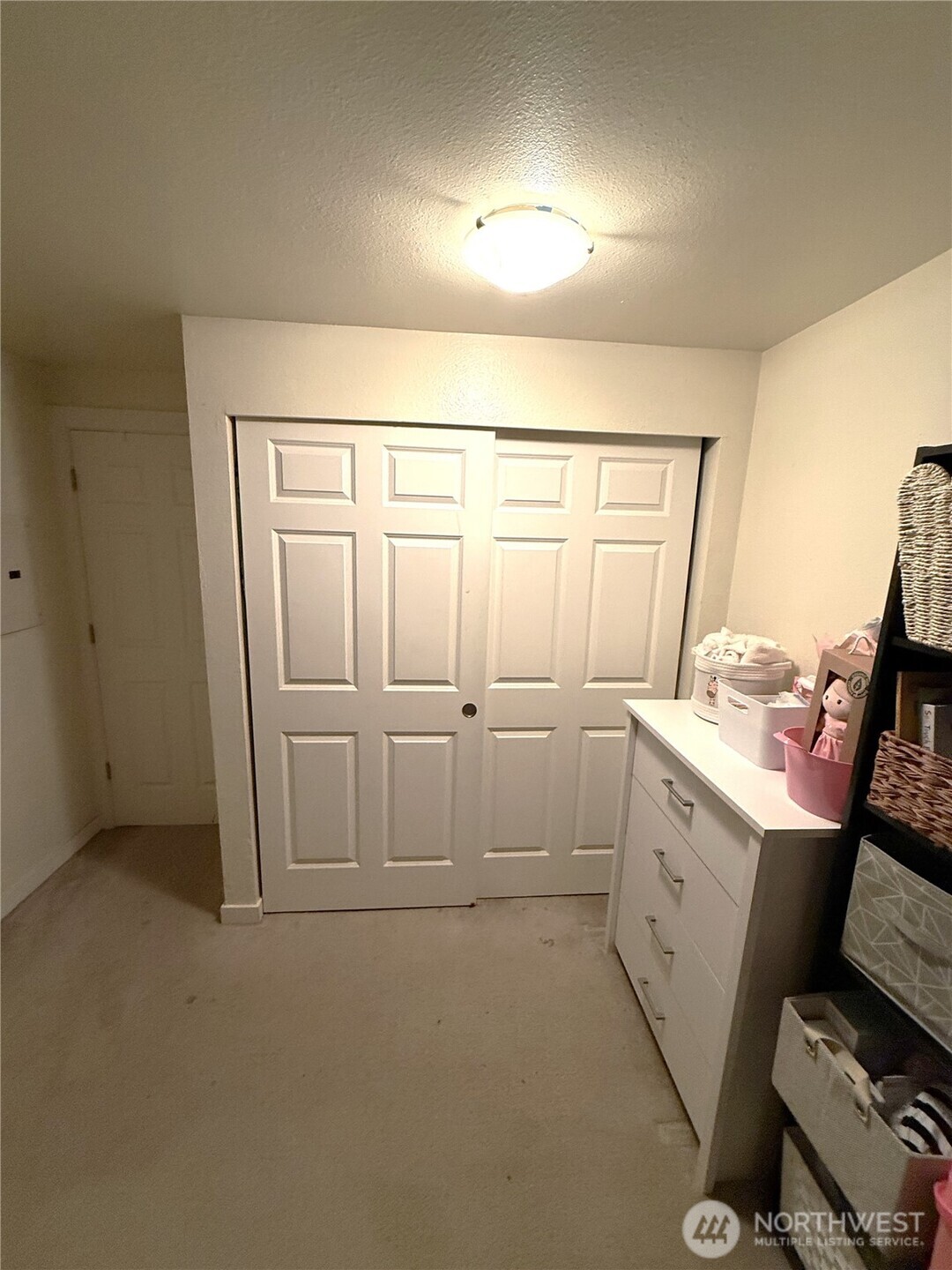 28716 18th Avenue South, Unit Y203 Federal Way, WA 98003 - Photo 30 of 37 a view of a room with racks on the wall