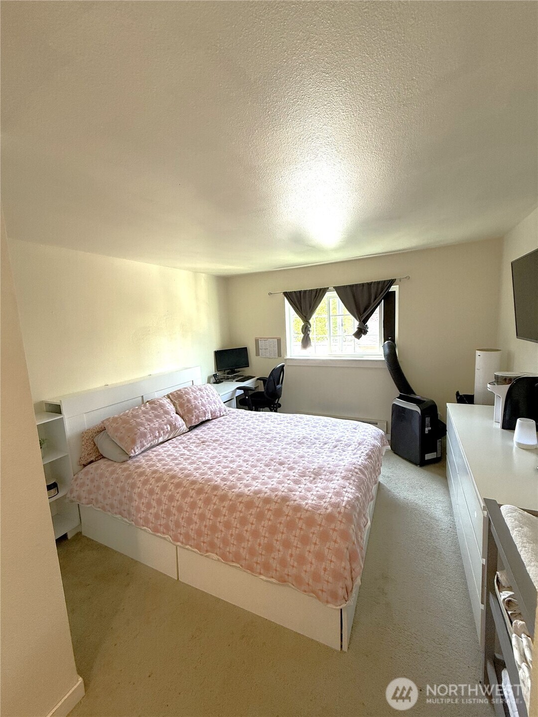 28716 18th Avenue South, Unit Y203 Federal Way, WA 98003 - Photo 33 of 37 a bedroom with a bed and a night stand