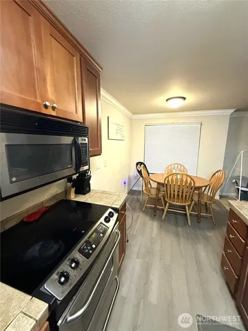 a kitchen with a stove and a microwave