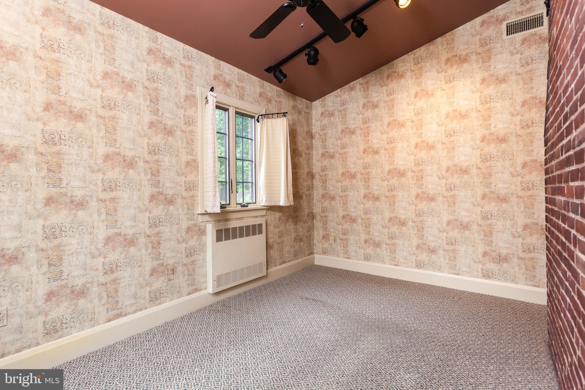 7109 Rich Hill Road Baltimore, MD 21212 - Photo 15 of 39 Study off den with exposed brick