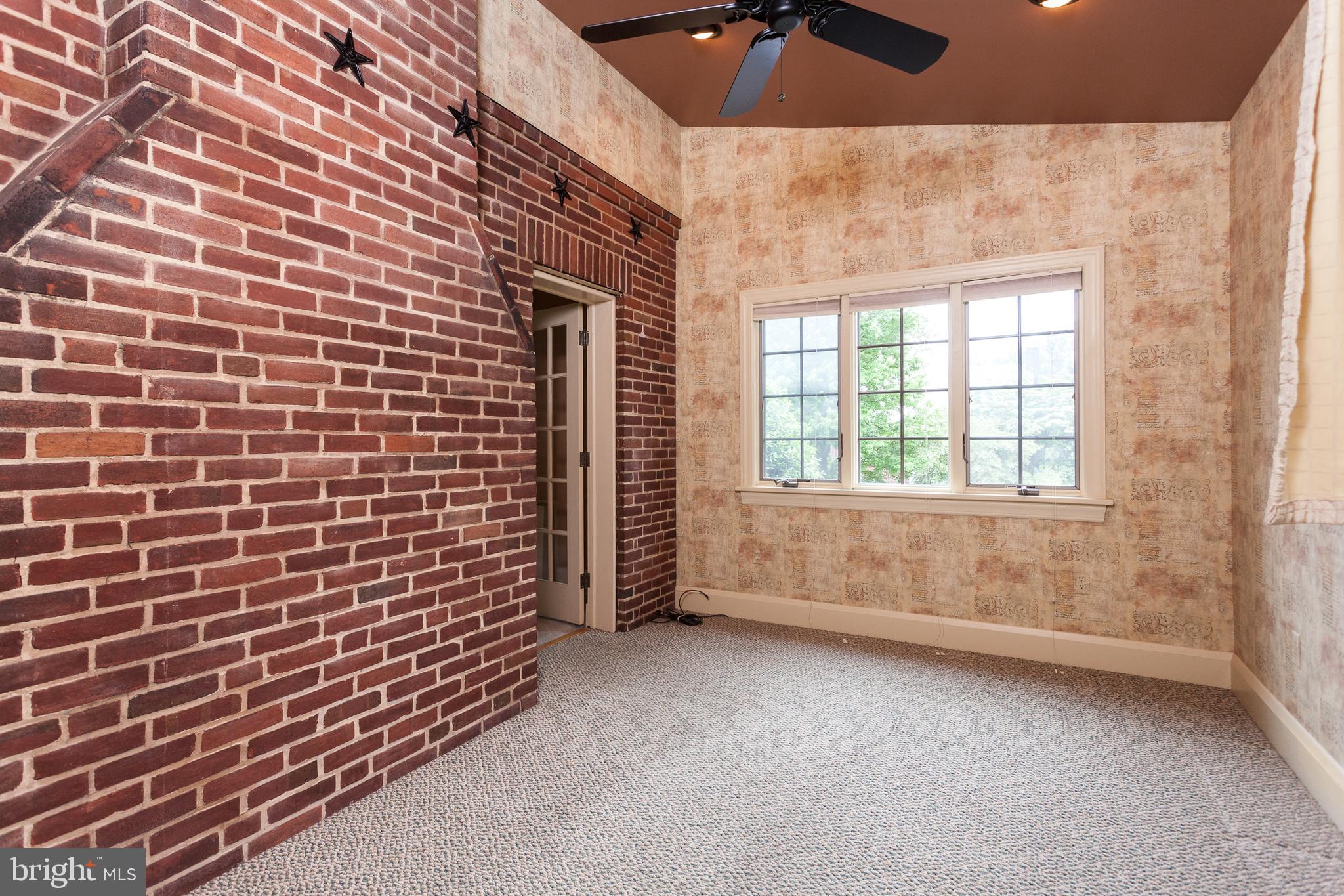 7109 Rich Hill Road Baltimore, MD 21212 - Photo 16 of 39 Study off den with exposed brick