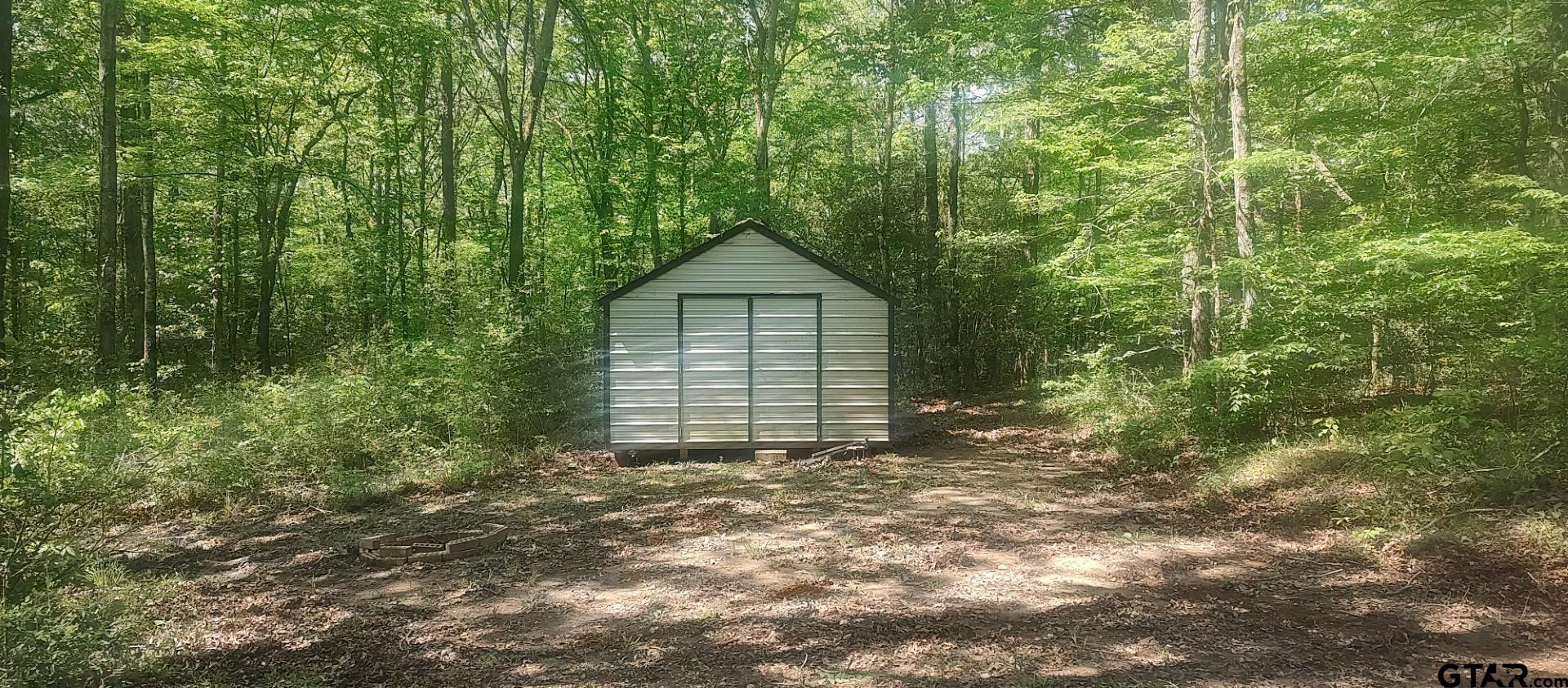 465 Barker Road Timpson, TX 75975 - Photo 3 of 34 a house with a tree in the background