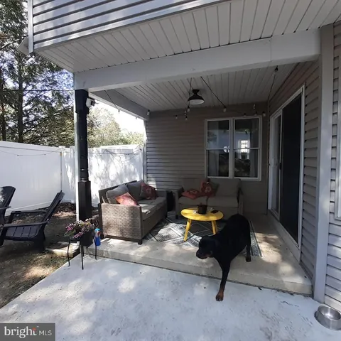 a outdoor space with patio furniture and a fireplace