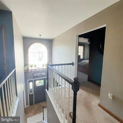 a view of entryway with a front door