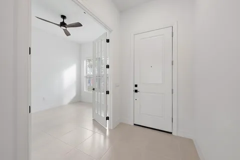 a view of an empty room with a window