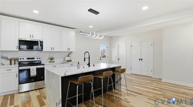 a view of entryway with wooden floor