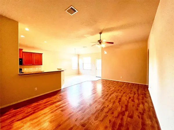 a view of a livingroom with wooden floor