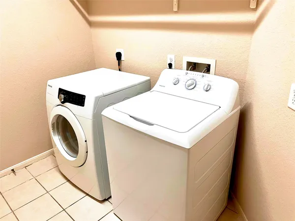a utility room with dryer and washer