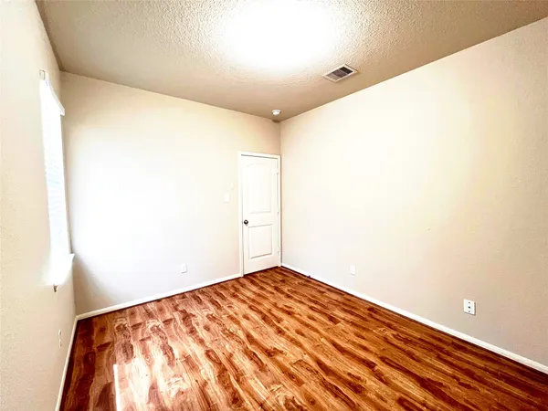 a view of a big room with wooden floor