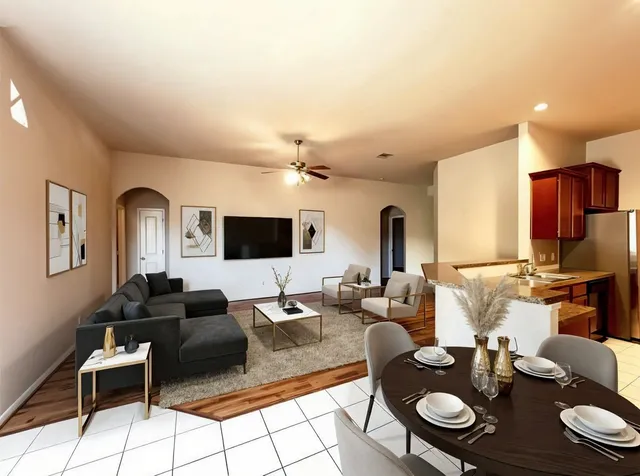 a bathroom with a tub a sink and a mirror