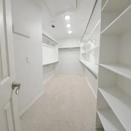 a view of a room with white walls