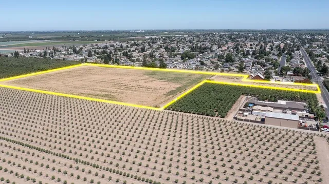 an aerial view of a house with a lake view