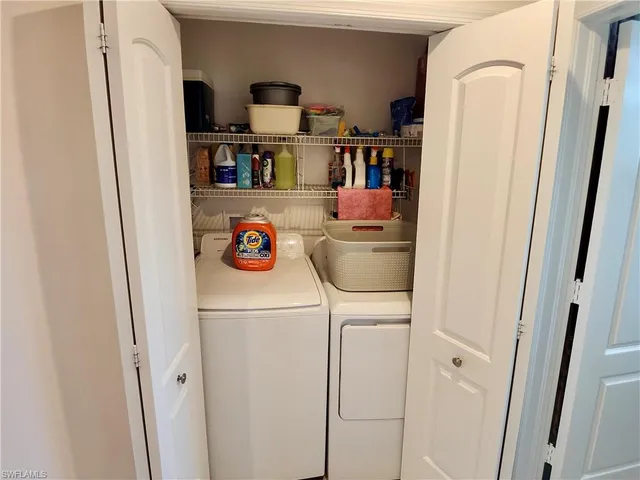 a room with refrigerator and washer