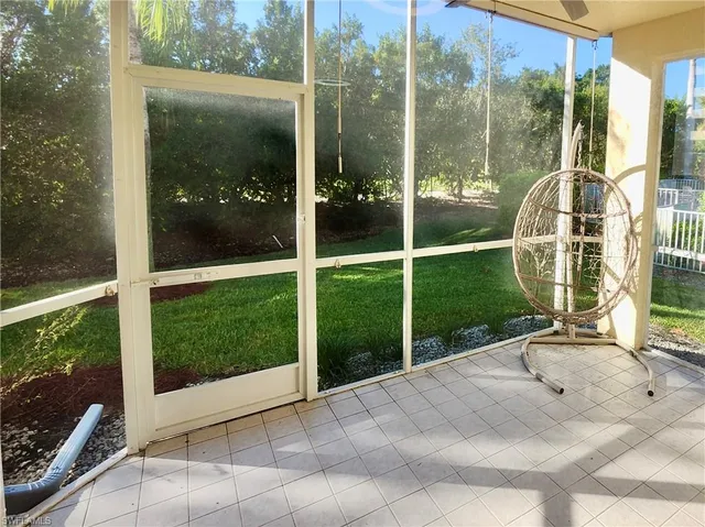 a white bath tub sitting next to a toilet