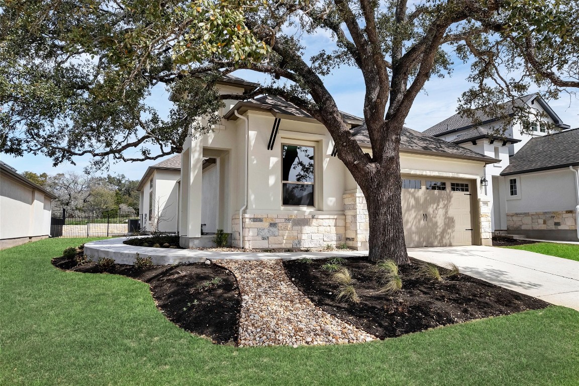 Nestled in the picturesque neighborhood of Water Oaks at San Gabriel. The Grass was enhanced to show spring potential.