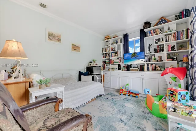 a room with furniture and baby toys