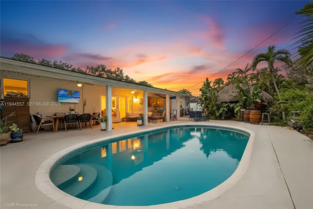 a view of swimming pool having outdoor seating
