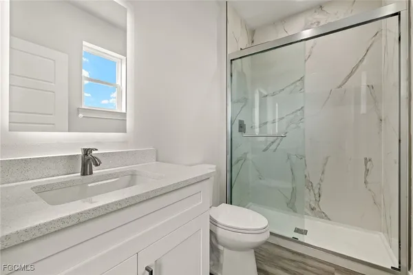 a view of room with window and hardwood floor