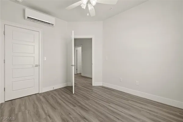 a view of room with wooden floor