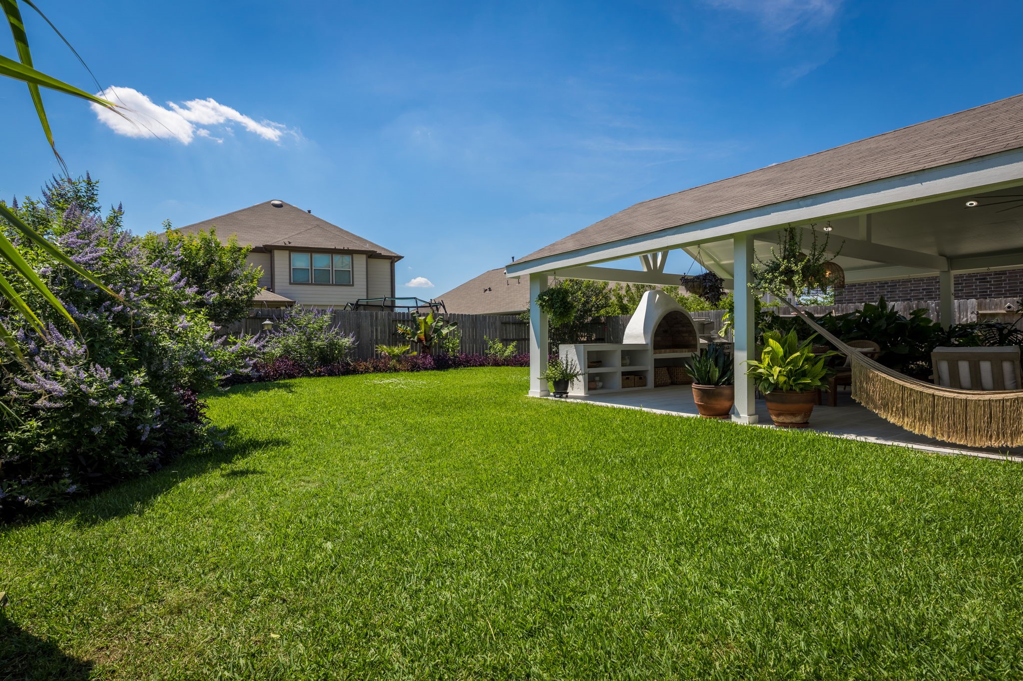 5127 Avondale Rise Street Katy, TX 77493 - Photo 45 of 47 a view of a garden from a patio