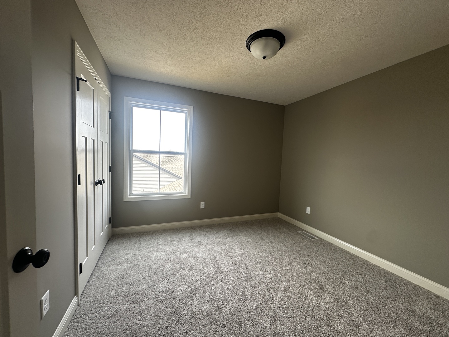 2511 Savanna Road Bloomington, IL 61705 - Photo 11 of 18 an empty room with a window