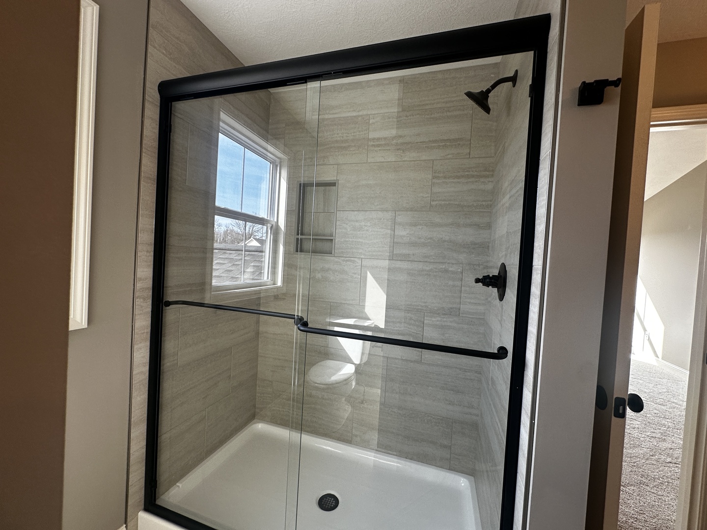 2511 Savanna Road Bloomington, IL 61705 - Photo 18 of 18 a bathroom with a glass shower door