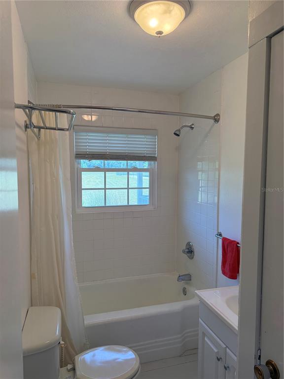 7390 South Mc Alpin Road McAlpin, FL 32062 - Photo 26 of 53 a bathroom with a tub a sink and a toilet