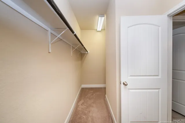 a living room with furniture ceiling fan and a flat screen tv