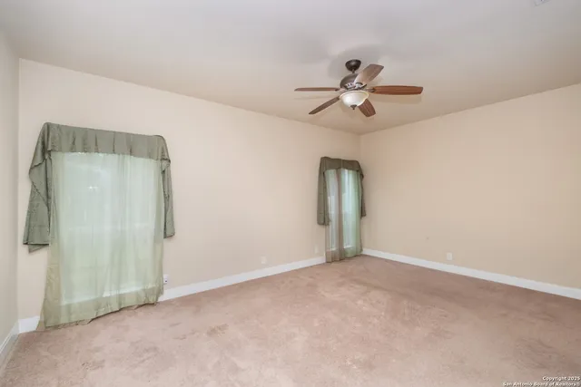 a bathroom with a bath tub a sink and a large mirror