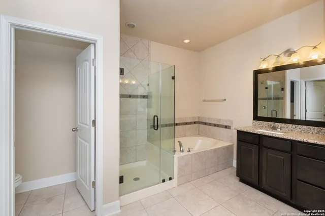 a white toilet sitting next to a shower
