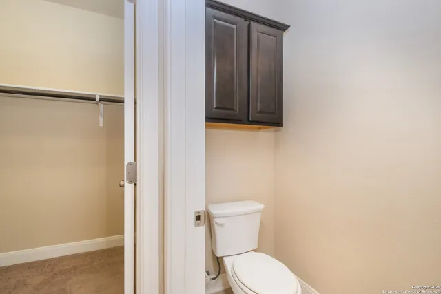 a view of a hallway with white walls