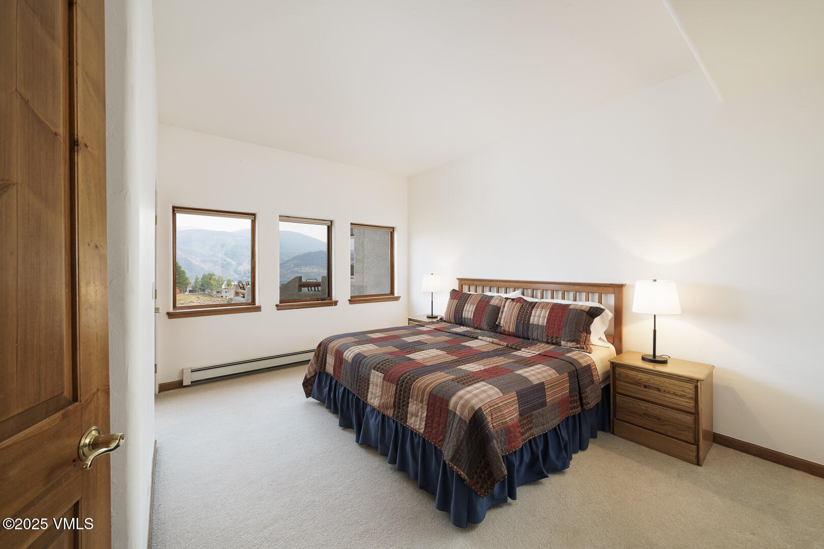 1341 Winslow Road, Unit B Edwards, CO 81632 - Photo 24 of 56 a bedroom with a bed lamp and a large window