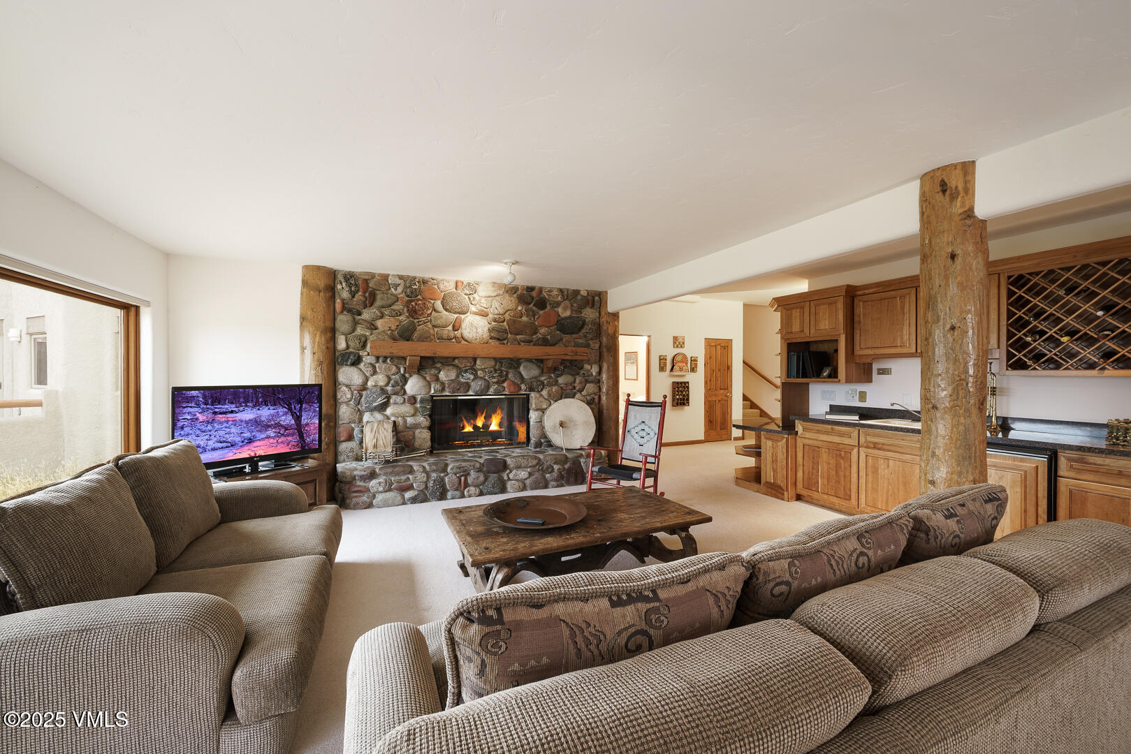1341 Winslow Road, Unit B Edwards, CO 81632 - Photo 27 of 56 a living room with furniture and a fireplace