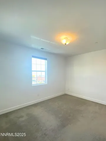 an empty room with a empty space and windows