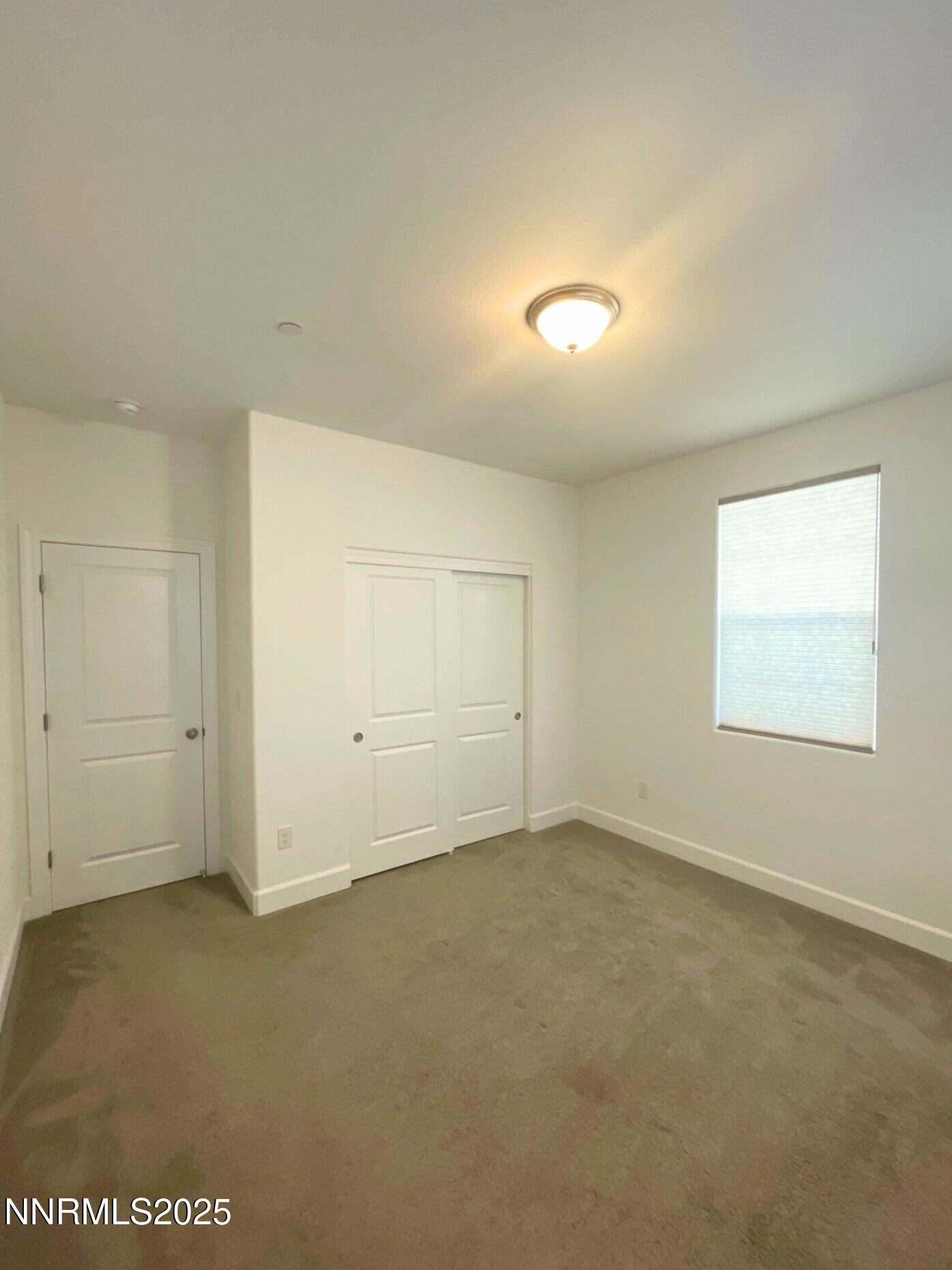 2018 Cradle Mountain Drive, Unit 1 Reno, NV 89523 - Photo 13 of 15 an empty room with a empty space and windows