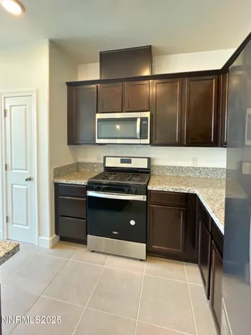 a kitchen with a stove and a sink