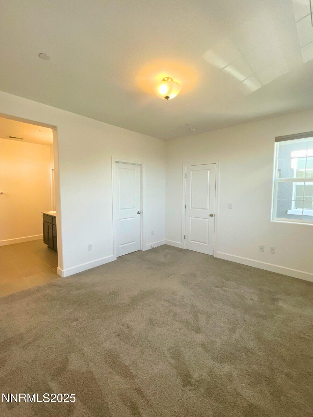 2018 Cradle Mountain Drive, Unit 1 Reno, NV 89523 - Photo 9 of 15 an empty room with windows