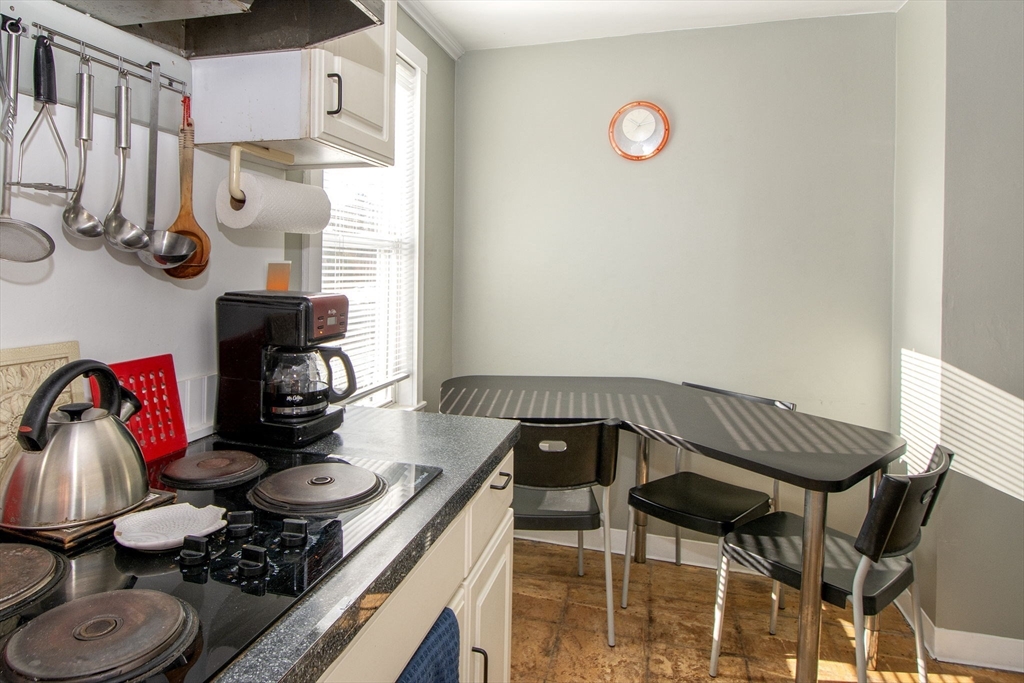 972 Liberty Street Braintree, MA 02184 - Photo 12 of 28 a view of kitchen island with furniture and appliances